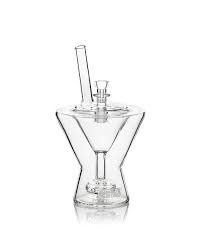 Don't shake it. Don't stir it. But do smoke it, and be sure to fill it with only top-shelf flower. Our Martini Glass bubbler is deceptively sleek. Expect potent, expansive hits filtered smooth by a unique, custom-fitted perc.
Part of the new GRAV sip series
Stands 4.5" tall at the top of the main chamber, 7" tall at the top of the straw
14mm female joint
Comes with a 14mm cup bowl
Features a broad swiss-hole perc

Designed  By : Micah Evans 
